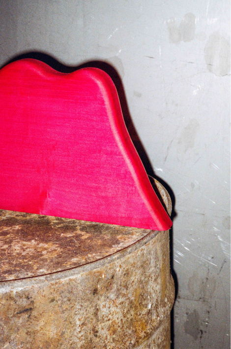 pink shelf on a rusty barrel